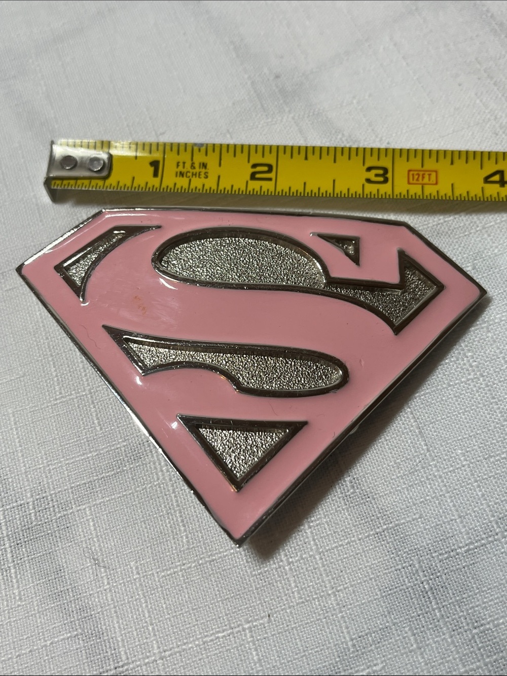DC Comics Supergirl logo belt buckle
pink enamel
metallic base 
Supergirl 'S’ - Picture 3 of 5